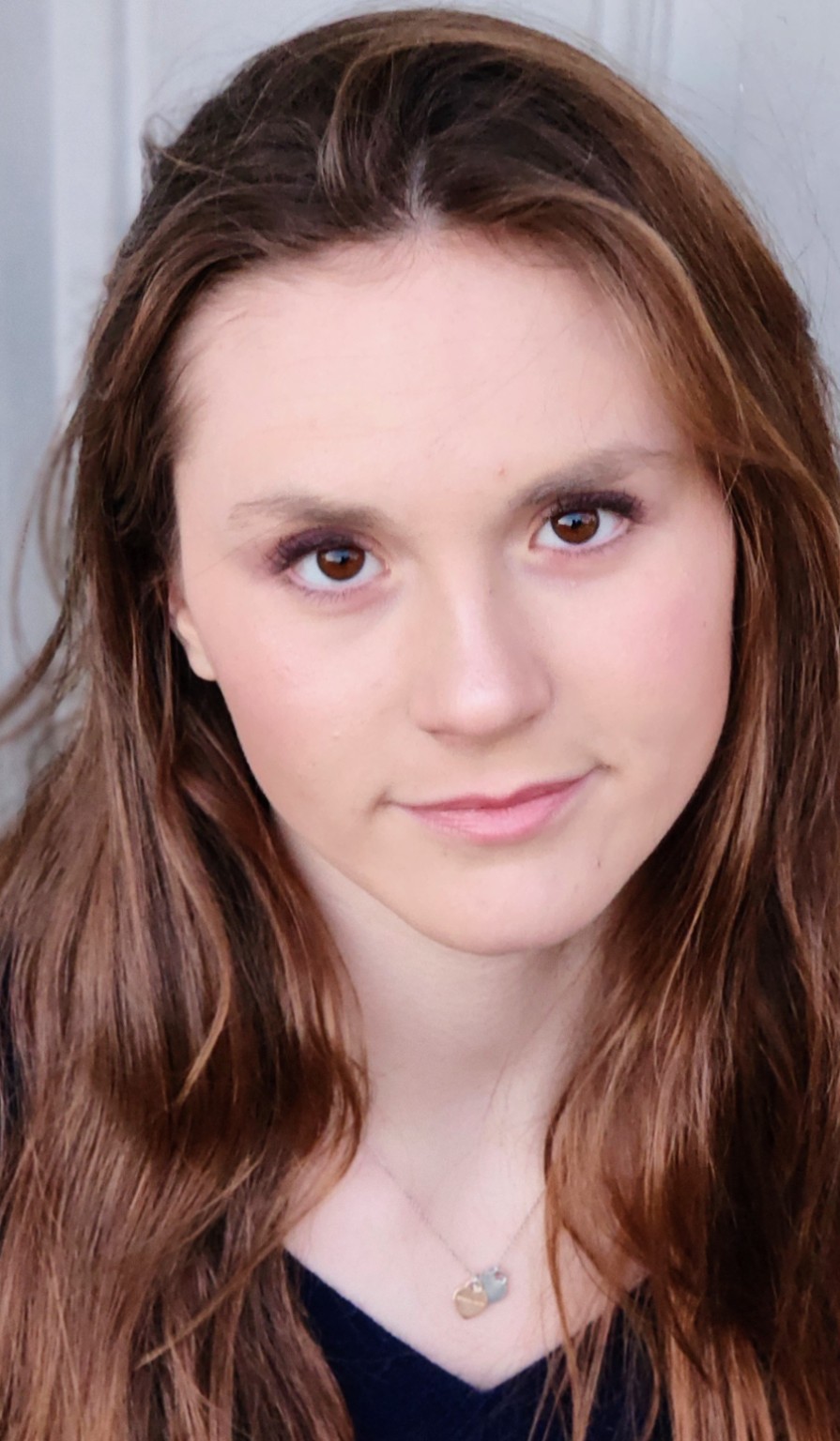 Expressive close-up headshot with direct eye contact
